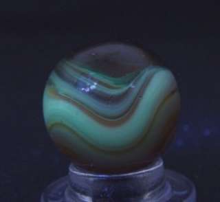   Vitro Agate or Akro Agate. It fluoresces under a black light and looks