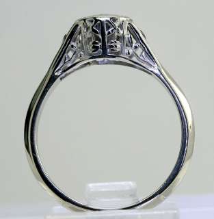   an antique style sapphire and 14k white gold ring measuring 5 16 inch
