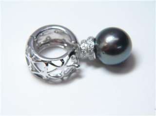 We are offering this Very Rare 13mm Black Pearl Enhancer with .72CT 