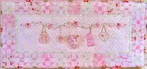 sachets and little love tags hang from this sweetly embroidered 