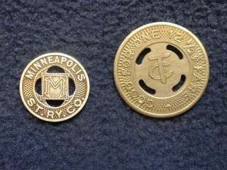 Two vintage Minneapolis  St. Paul street car tokens. Smaller token is 