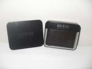 UP FOR BIDS IS BRAND NEW IN BOX GUESS LEATHER EMBOSSED
