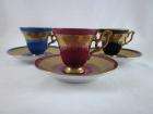   matching arnart demitasse cups and saucers in red blue and black they