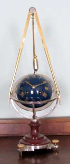 Ball Clock , With an Over Hanging Pendulum Bob That Regulates The Time 